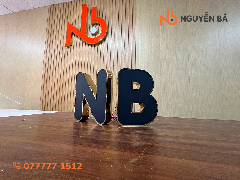Gia công chữ inox vàng gương mặt mica đen xuyên đèn